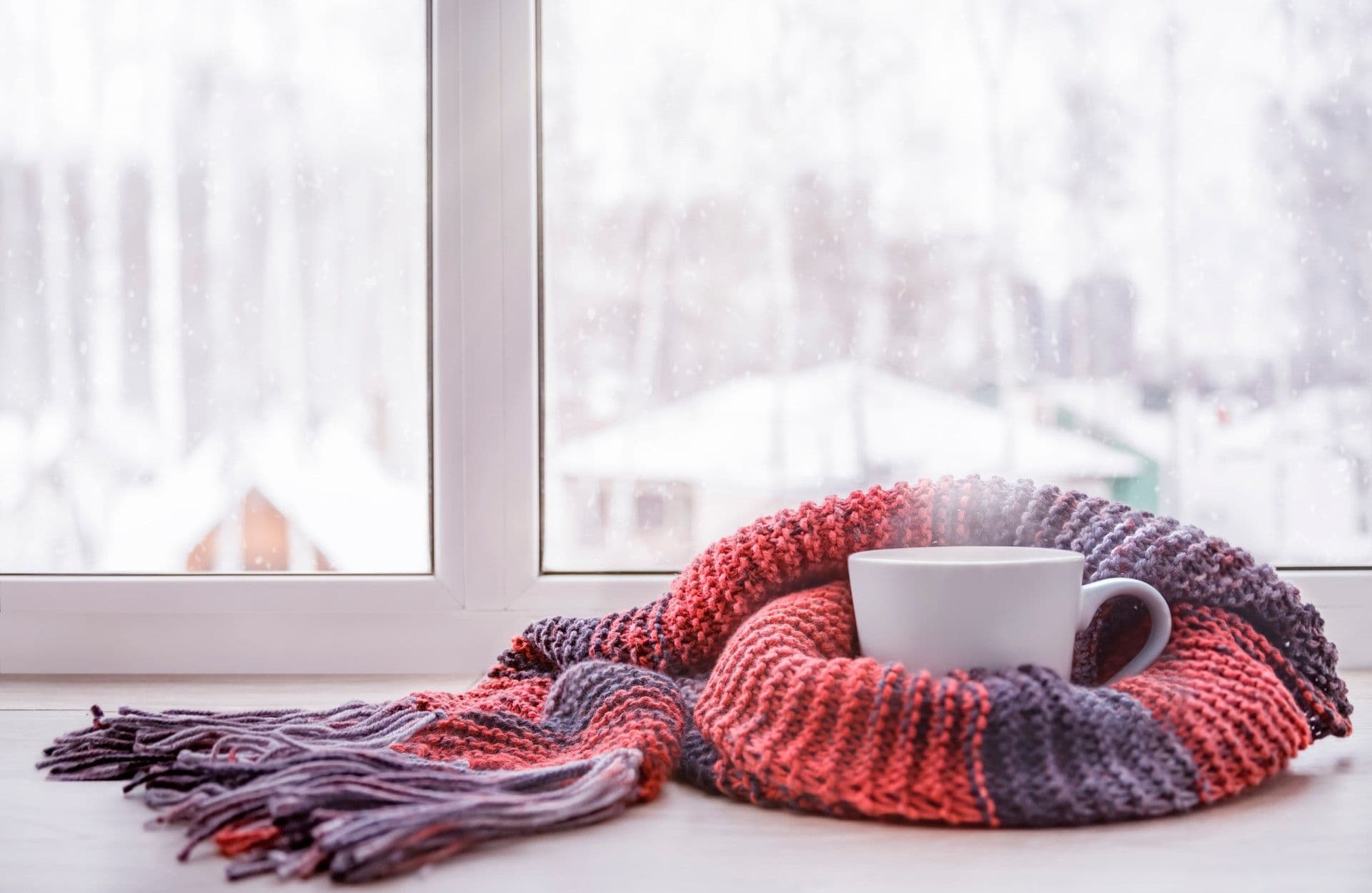 Coffee with scarf in front of window